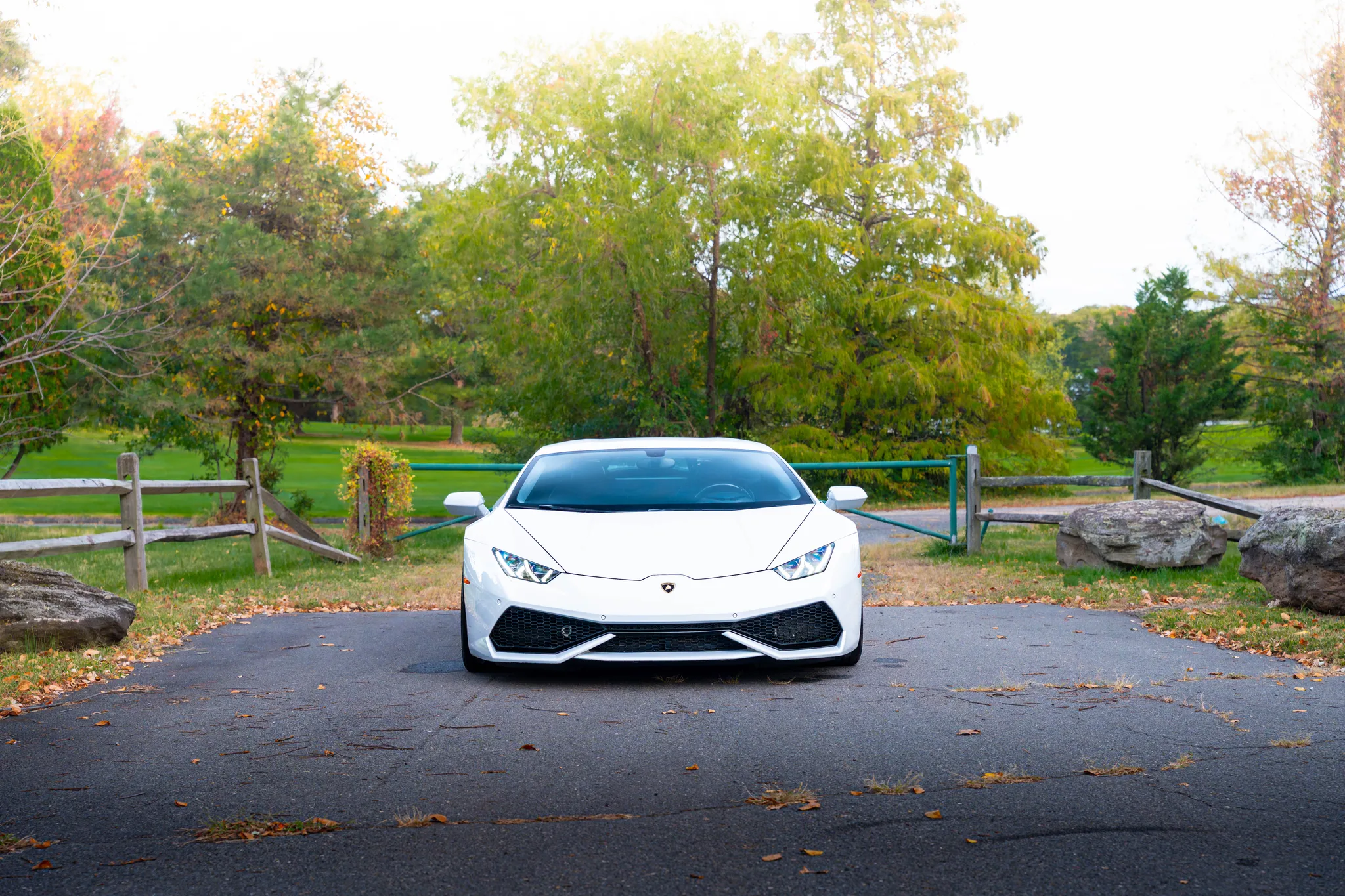 White Lamborghini Huracan 610-4 three-quarter angle — two-tone exotic supercar rental