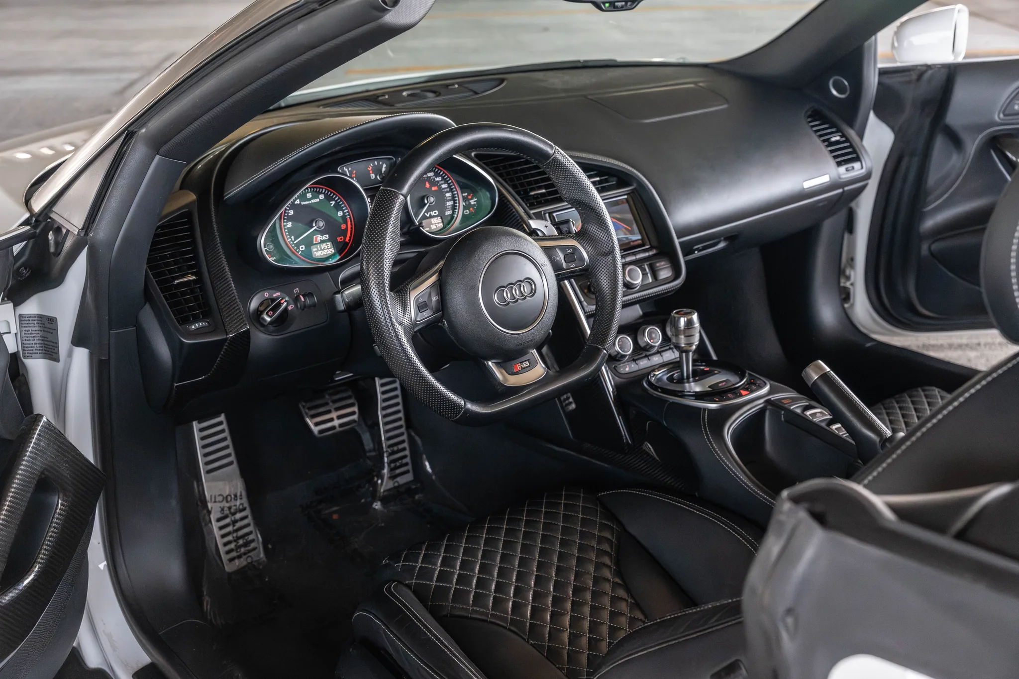 Audi R8 V10 Plus Spyder cockpit — driver-focused interior and virtual cockpit